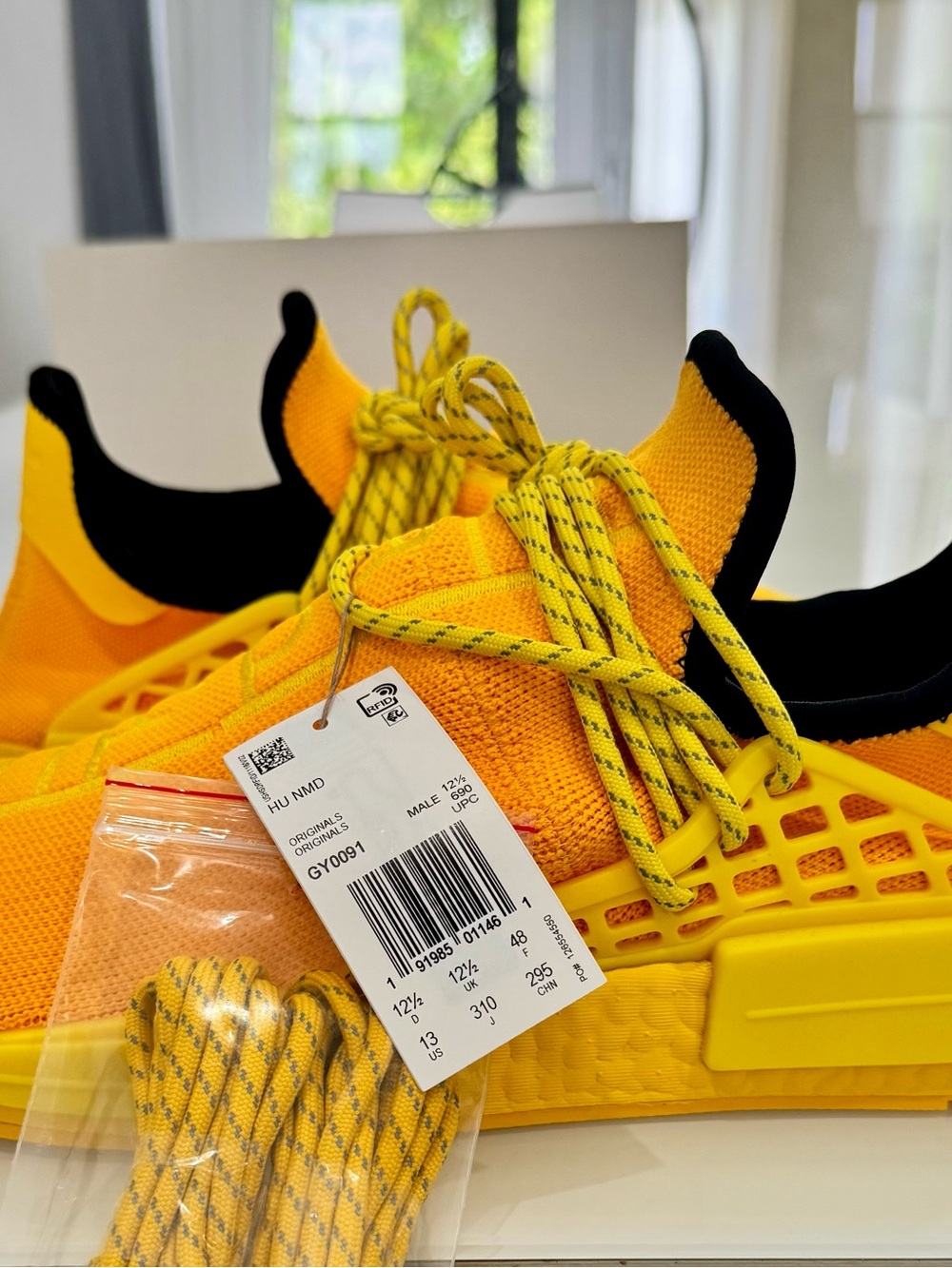 Adidas Pharrell NMD HU size 13 in the Yellow and Black color way. Brand new.